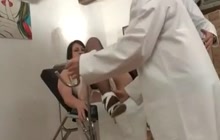 Patient in black stockings having fun with her doctor